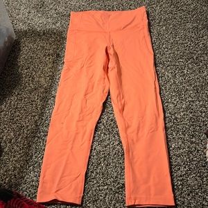 peach colored under armour capris